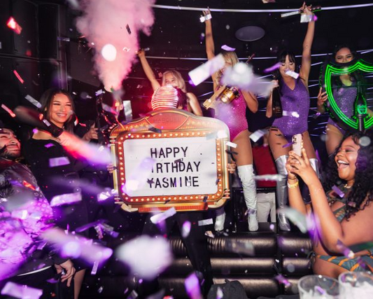 Best confetti popper for nightclubs in use during a VIP birthday celebration with bottle girls, LED props, and custom signboard