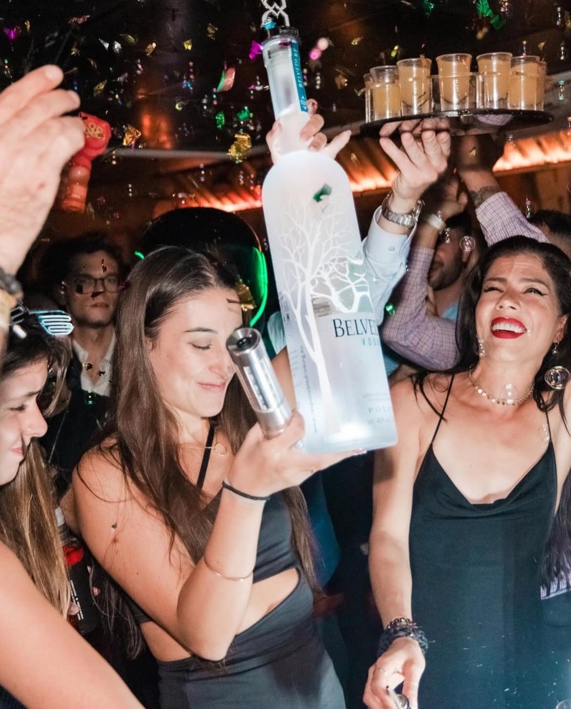 Best confetti popper for nightclub bottle service and VIP celebrations, shown mid-blast with foil streamers