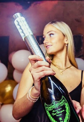VIP LED bottle sparkler baton for nightclub bottle service, mounted on Dom Pérignon